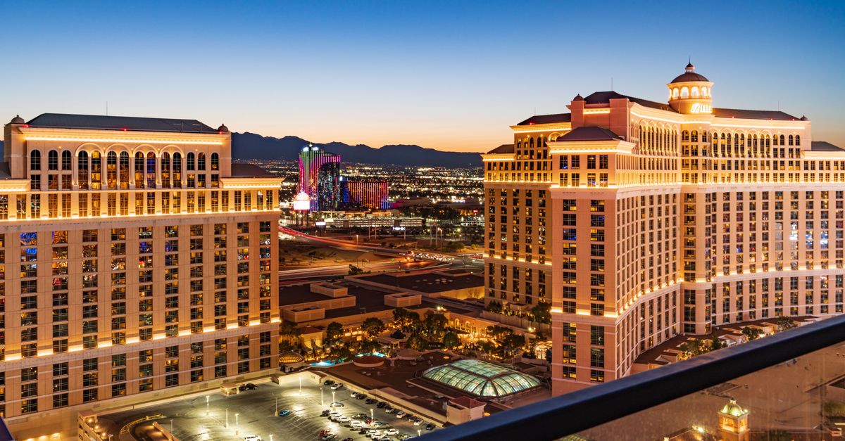 Stunning aerial view of the illuminated Bellagio Hotel and Las Vegas skyline during twilight.